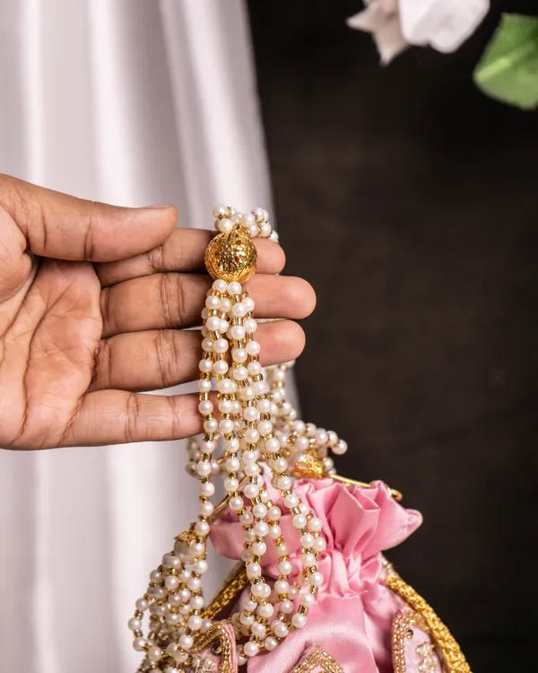 The_Blush_Lotus–_Handcrafted_Pearl_Handle_Evening_lotus_Potli_Bag